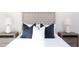 Comfortable bedroom with decorative pillows and side tables, providing a relaxing retreat at 600 N Roxboro St # 24, Durham, NC 27701