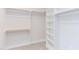 Spacious walk-in closet featuring custom shelving and ample hanging space at 600 N Roxboro St # 24, Durham, NC 27701