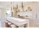 Modern kitchen with a large island, bar stool seating, stainless steel appliances, and decorative accents at 600 N Roxboro St # 24, Durham, NC 27701