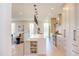 Modern kitchen featuring an island with quartz countertop, sleek cabinetry, and stainless steel appliances at 600 N Roxboro St # 24, Durham, NC 27701