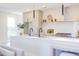 Bright kitchen features sleek countertops, modern fixtures, stainless steel appliances, and a view to the outside at 600 N Roxboro St # 24, Durham, NC 27701