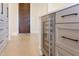 Modern kitchen featuring wine fridge, dark wood door and plenty of cabinetry at 600 N Roxboro St # 24, Durham, NC 27701