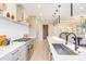 Spacious kitchen features a long island, stainless steel appliances, and a view to the formal dining room at 600 N Roxboro St # 24, Durham, NC 27701