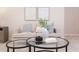 Cozy living room with plush sofa and glass coffee tables, perfect for relaxing and entertaining at 600 N Roxboro St # 24, Durham, NC 27701