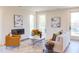 Cozy living room with modern decor, fireplace, stylish furniture, and plenty of natural light at 600 N Roxboro St # 24, Durham, NC 27701