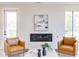 Cozy living room featuring a modern fireplace, comfortable seating, and plenty of natural light at 600 N Roxboro St # 24, Durham, NC 27701