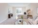 Sunlit main bedroom with cozy seating area and a view of the outdoors at 600 N Roxboro St # 24, Durham, NC 27701