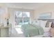 Serene main bedroom with sliding glass doors to balcony, a soothing color palette, and plenty of natural light at 600 N Roxboro St # 24, Durham, NC 27701