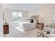 Bright bedroom with large window, neutral palette, and stylish furnishings at 600 N Roxboro St # 24, Durham, NC 27701