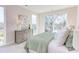 Bright main bedroom boasts walkout balcony, lots of light, neutral tones, and comfortable decor at 600 N Roxboro St # 24, Durham, NC 27701