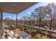 Spacious balcony with stylish furniture offers a perfect outdoor retreat with views of the neighborhood and trees at 600 N Roxboro St # 43, Durham, NC 27701