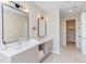 Spacious bathroom with double sinks, granite countertop, modern design, and a glass shower at 600 N Roxboro St # 43, Durham, NC 27701
