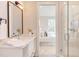 Inviting bathroom leading to a Primary bedroom with a shower and bathtub, blending luxury and convenience at 600 N Roxboro St # 43, Durham, NC 27701