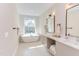 Bright and open bathroom with a soaking tub, double vanities, and modern fixtures at 600 N Roxboro St # 43, Durham, NC 27701