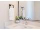 Modern bathroom sink with stylish faucet, soap dispenser, succulent and mirror at 600 N Roxboro St # 43, Durham, NC 27701
