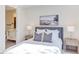 Cozy bedroom with a gray upholstered headboard, stylish nightstands, and modern lamps for a relaxing ambiance at 600 N Roxboro St # 43, Durham, NC 27701