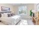 Cozy bedroom filled with natural light, featuring a comfortable bed, stylish decor, and a calming ambiance at 600 N Roxboro St # 43, Durham, NC 27701