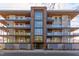 Stunning building facade showcasing multiple balconies, modern architecture, and a welcoming entrance at 600 N Roxboro St # 43, Durham, NC 27701