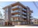 Elegant condo building with glass balconies, modern design, and convenient covered parking at 600 N Roxboro St # 43, Durham, NC 27701