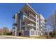 Stylish, multi-story condo building featuring sleek lines, private balconies, and contemporary design at 600 N Roxboro St # 43, Durham, NC 27701