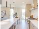 Modern kitchen with a large island, sleek cabinetry, and stainless steel appliances, offering neighborhood views at 600 N Roxboro St # 43, Durham, NC 27701