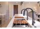 Modern kitchen island with built-in cooktop, sleek countertops, and stainless steel appliances at 600 N Roxboro St # 43, Durham, NC 27701