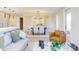 View of an open living space into the dining room with modern décor, a statement light fixture, and ample natural light at 600 N Roxboro St # 43, Durham, NC 27701