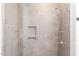 Modern walk-in shower with sleek tile work, built-in shelves, and contemporary fixtures at 600 N Roxboro St # 43, Durham, NC 27701