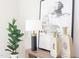 Stylish table setting with a modern lamp, decorative vases, and vibrant green plant at 600 N Roxboro St # 43, Durham, NC 27701