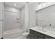 Full bathroom featuring a shower-tub combo, vanity, and grey walls at 2329 E Main St, Durham, NC 27703