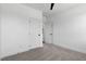 Neutral bedroom featuring soft carpet, white walls, a ceiling fan, and a convenient closet for ample storage at 2329 E Main St, Durham, NC 27703