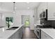 Well-equipped kitchen with stainless steel appliances, modern fixtures, and backyard view at 2329 E Main St, Durham, NC 27703
