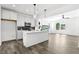 Open layout kitchen features a spacious island and connects seamlessly to a sunlit living area at 2329 E Main St, Durham, NC 27703