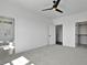Spacious bedroom featuring a ceiling fan, closet and an ensuite bath with a glass enclosed shower at 2329 E Main St, Durham, NC 27703
