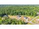 Aerial view of the new house and others being built in the neighborhood surrounded by woods at 4268 Jacks Creek Trl, Burlington, NC 27215
