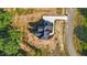 An aerial view of the house featuring the roof and driveway on a sunny day at 4268 Jacks Creek Trl, Burlington, NC 27215