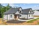 New construction showing a beautiful two-story home with gray shingles and white siding at 4268 Jacks Creek Trl, Burlington, NC 27215