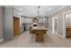 Spacious kitchen boasts custom cabinets, a large island with a wooden base, and modern lighting at 4268 Jacks Creek Trl, Burlington, NC 27215