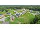 An aerial view of homes nestled in a residential area with lush green landscaping and well-maintained streets at 75 Woodbark Cv # 10, Willow Springs, NC 27592