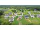 An aerial view of suburban homes nestled in a residential area with lush green landscaping at 75 Woodbark Cv # 10, Willow Springs, NC 27592