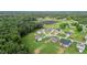 An aerial view of homes within a residential neighborhood, surrounded by lush green landscaping at 75 Woodbark Cv # 10, Willow Springs, NC 27592