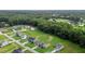 Aerial view of the community with many trees, roads, and neighboring homes at 75 Woodbark Cv # 10, Willow Springs, NC 27592