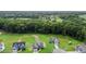Birds eye view of houses, a tree line and green grass, in a Gathering neighborhood at 75 Woodbark Cv # 10, Willow Springs, NC 27592