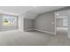 Neutral bedroom with new carpet, light gray walls and a bright window at 75 Woodbark Cv # 10, Willow Springs, NC 27592