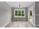 Bright dining room features large windows and a door leading to the outdoor space at 75 Woodbark Cv # 10, Willow Springs, NC 27592