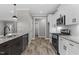 Spacious kitchen with a sink, gas range, microwave, and modern cabinetry at 75 Woodbark Cv # 10, Willow Springs, NC 27592