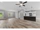 Hardwood floors define this open-concept space connecting the living area, dining, and kitchen at 75 Woodbark Cv # 10, Willow Springs, NC 27592