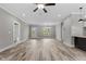Hardwood floors, grey walls, and an open floorplan define this flexible living space at 75 Woodbark Cv # 10, Willow Springs, NC 27592