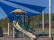 Playset with slide and shade canopy at 95 Colonial Trail Ct, Pittsboro, NC 27312