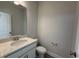 Small bathroom with white vanity, modern faucet, and a framed mirror at 492 Traditions Grande Blvd # 26, Wake Forest, NC 27587